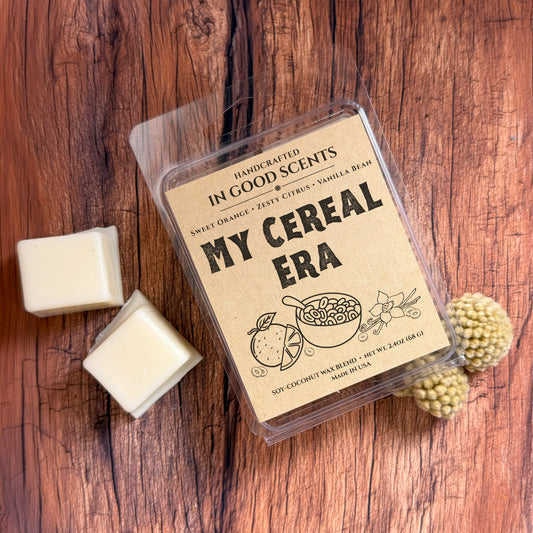 Handcrafted wax melt packaging labeled 'My Cereal Era' on a wooden surface.