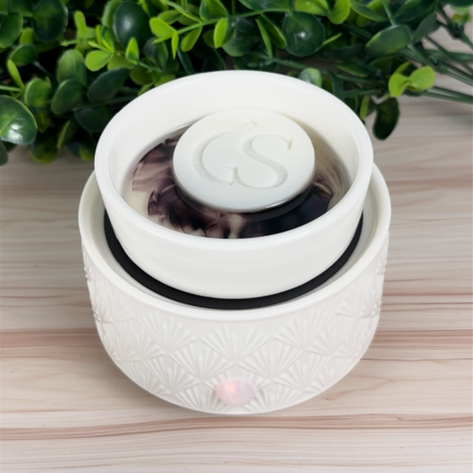 Night Reset wax melt warmer showing dark purple color reveal swirl with GS logo melt on top