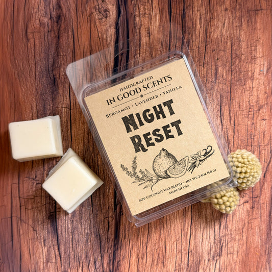 Handcrafted wax melt package labeled 'Night Reset' on a wooden surface