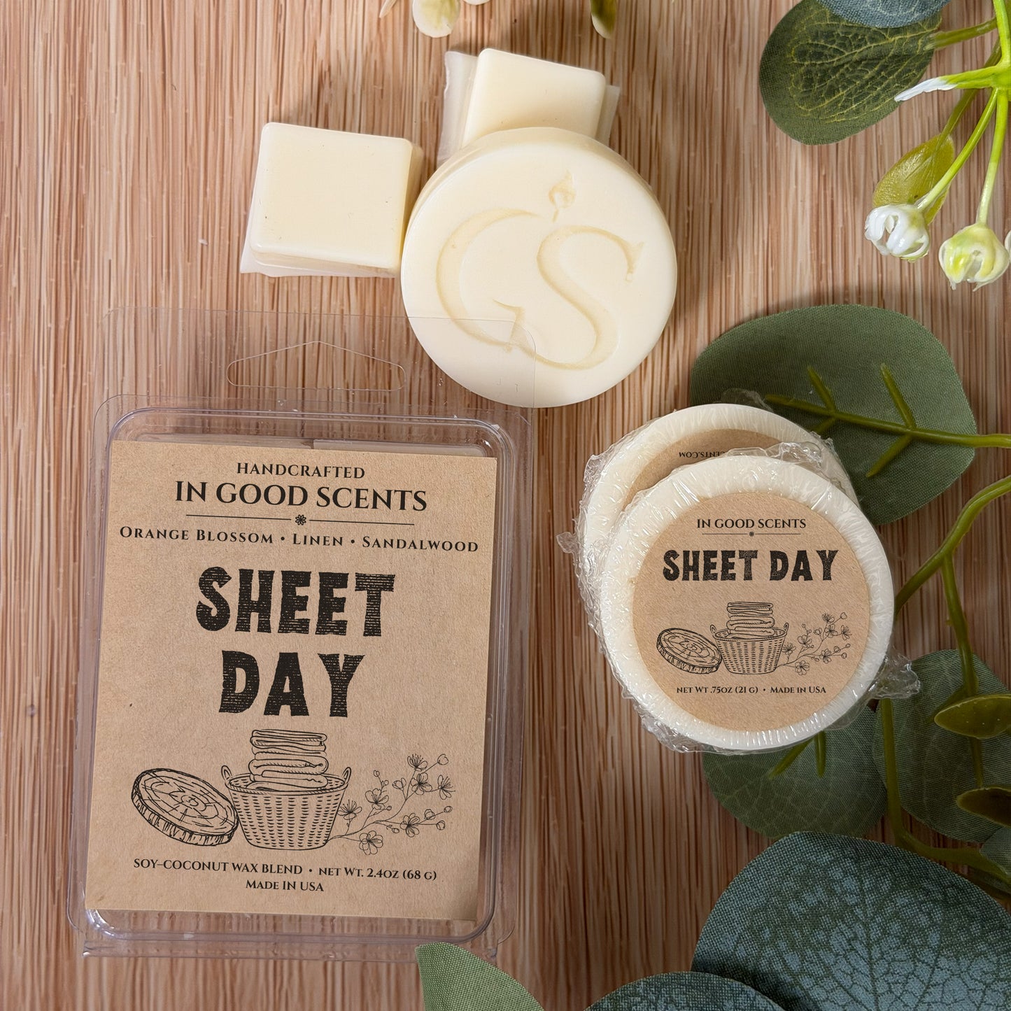 Handcrafted wax melts with 'In Good Scents' branding on a wooden surface.