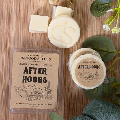 Handcrafted wax melts and packaging on a wooden surface with greenery.