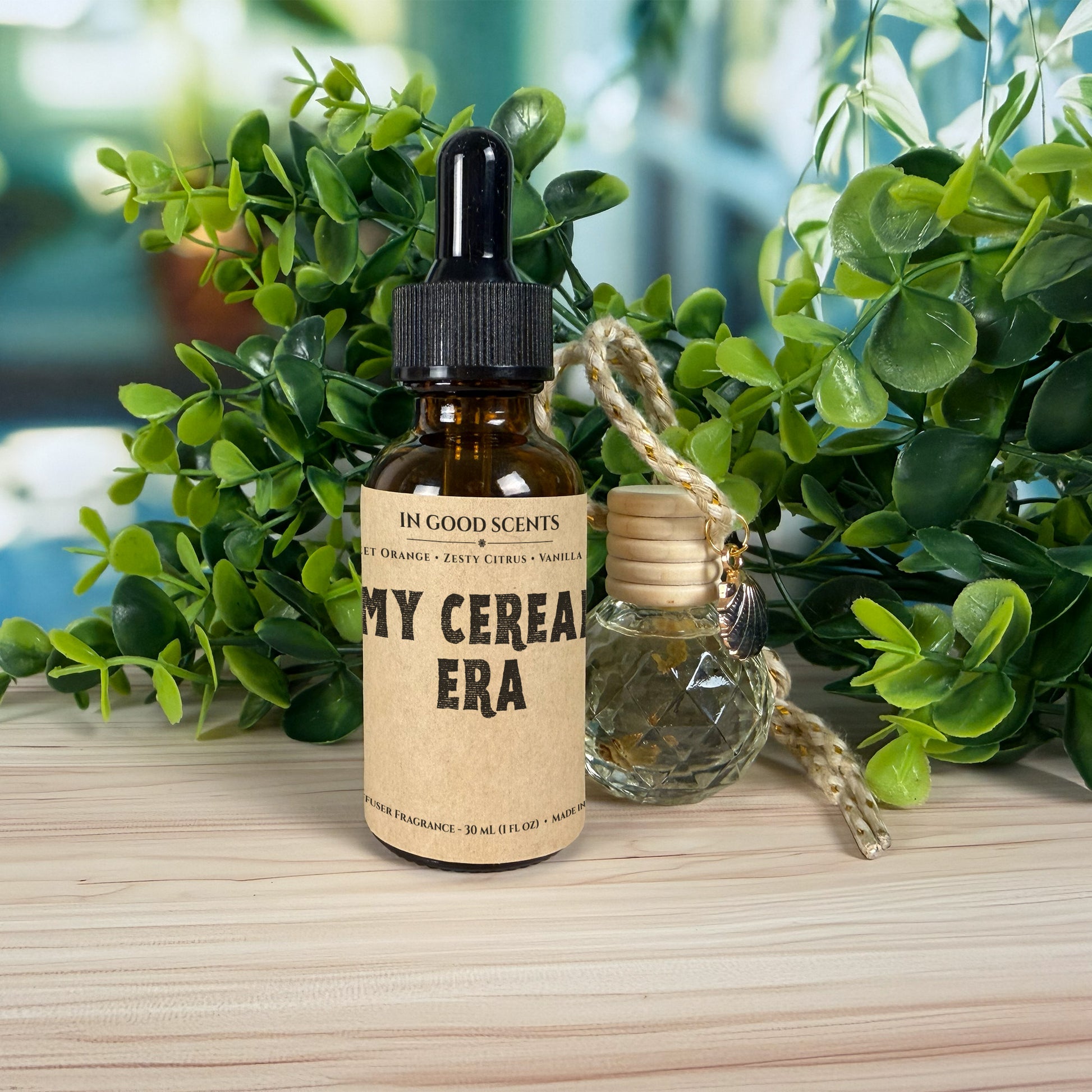 Bottle of 'My Cereals Era' with dropper and small bottle on a wooden surface with green plants in the background