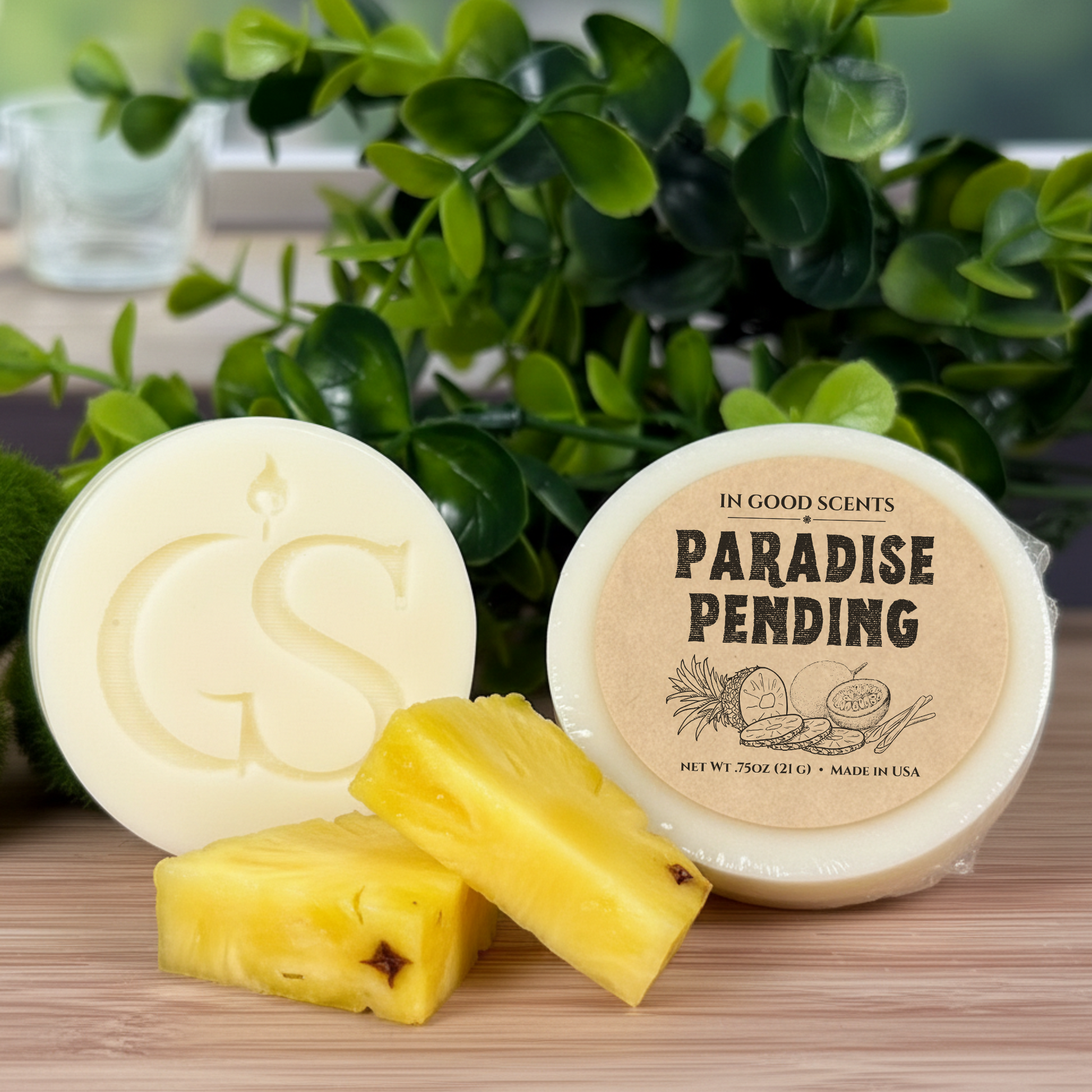 In Good Scents Paradise Pending wax melt tart with GS logo, pineapple pieces, and green plant background.