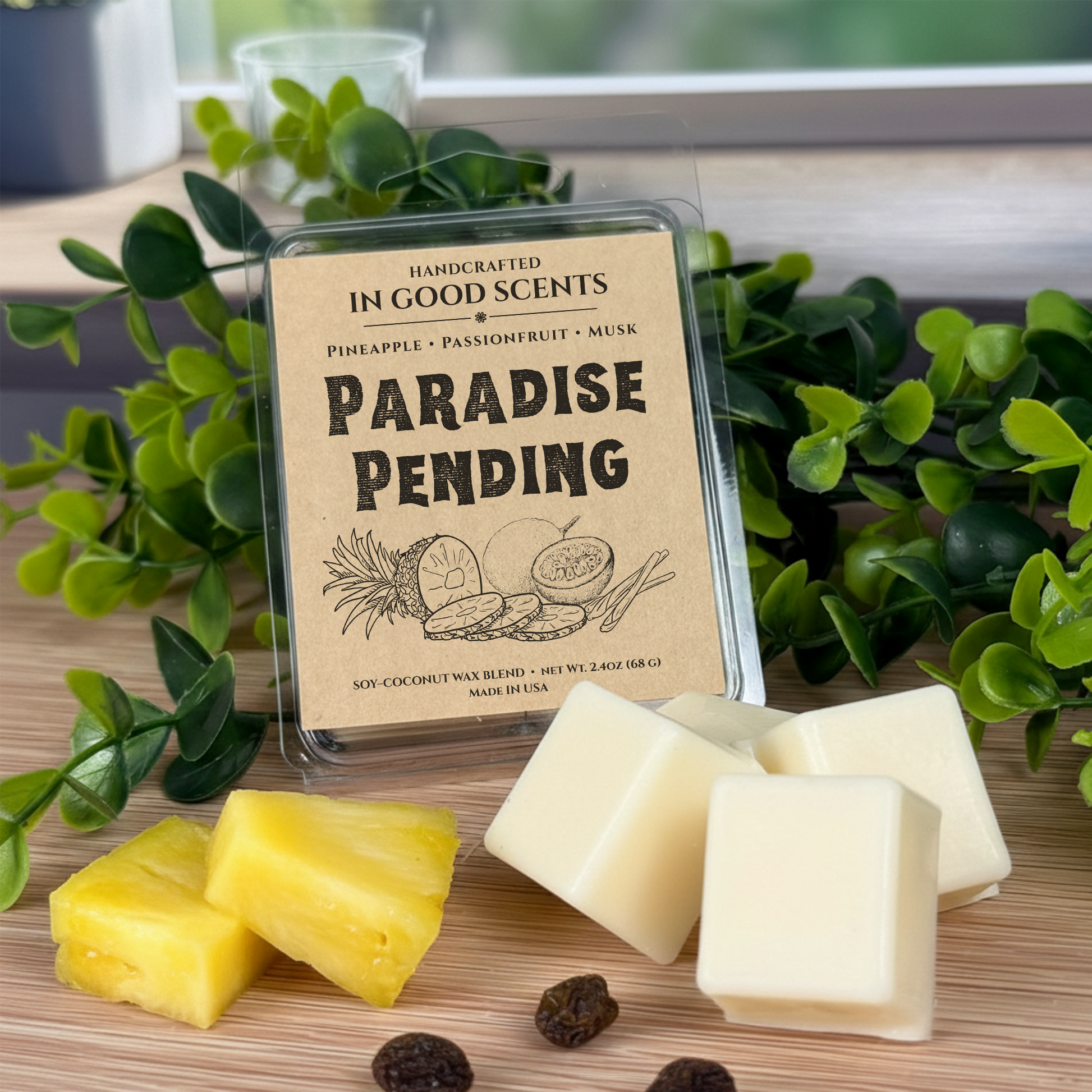Paradise Pending wax melts clamshell by In Good Scents with pineapple pieces and creamy wax cubes on wood surface.
