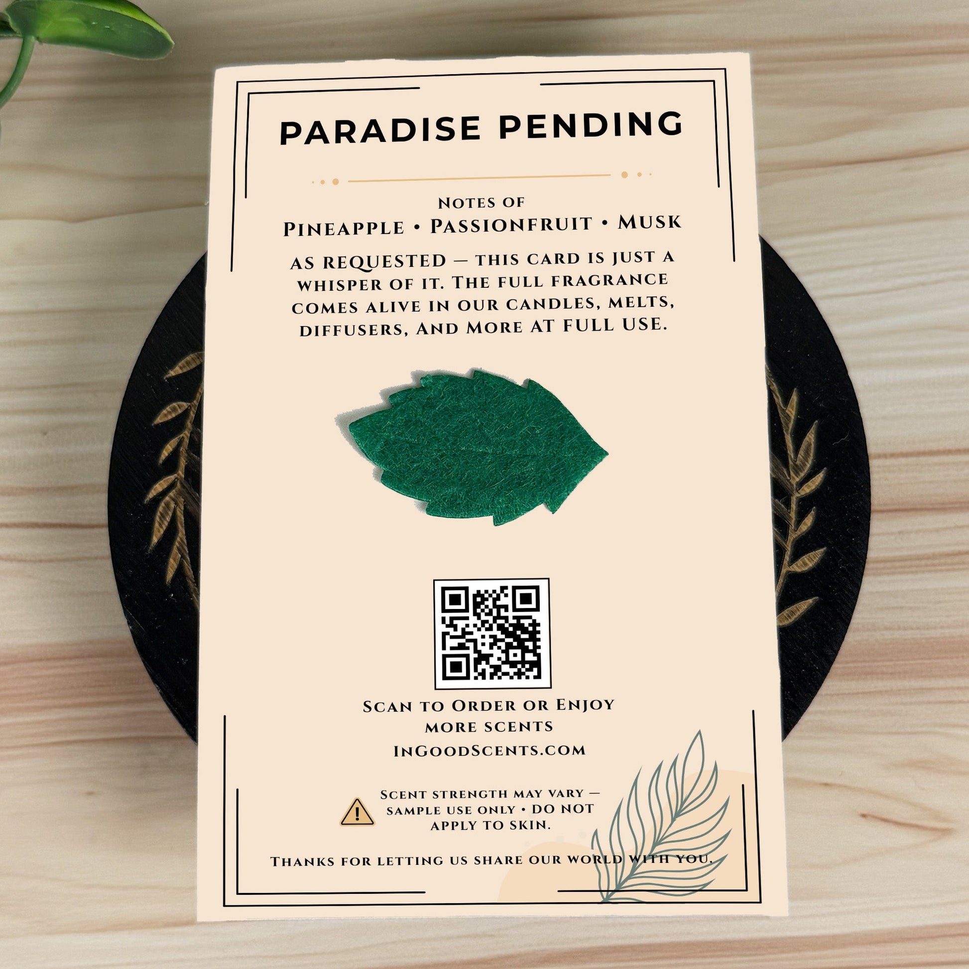 Product label for 'Ambered Bourbon' with text and a QR code on a wooden surface.